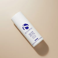 a white bottle packaging of antioxidant-rich sunscreen of iS Clinical Eclipse SPF 50+ Perfect Tint Beige, available in Sydney beauty clinic