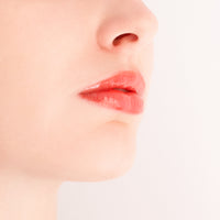 Applying Monika Heiligmann Lips In Love Trio for hydrated, plump, Parisian-inspired lips – available at Amirova