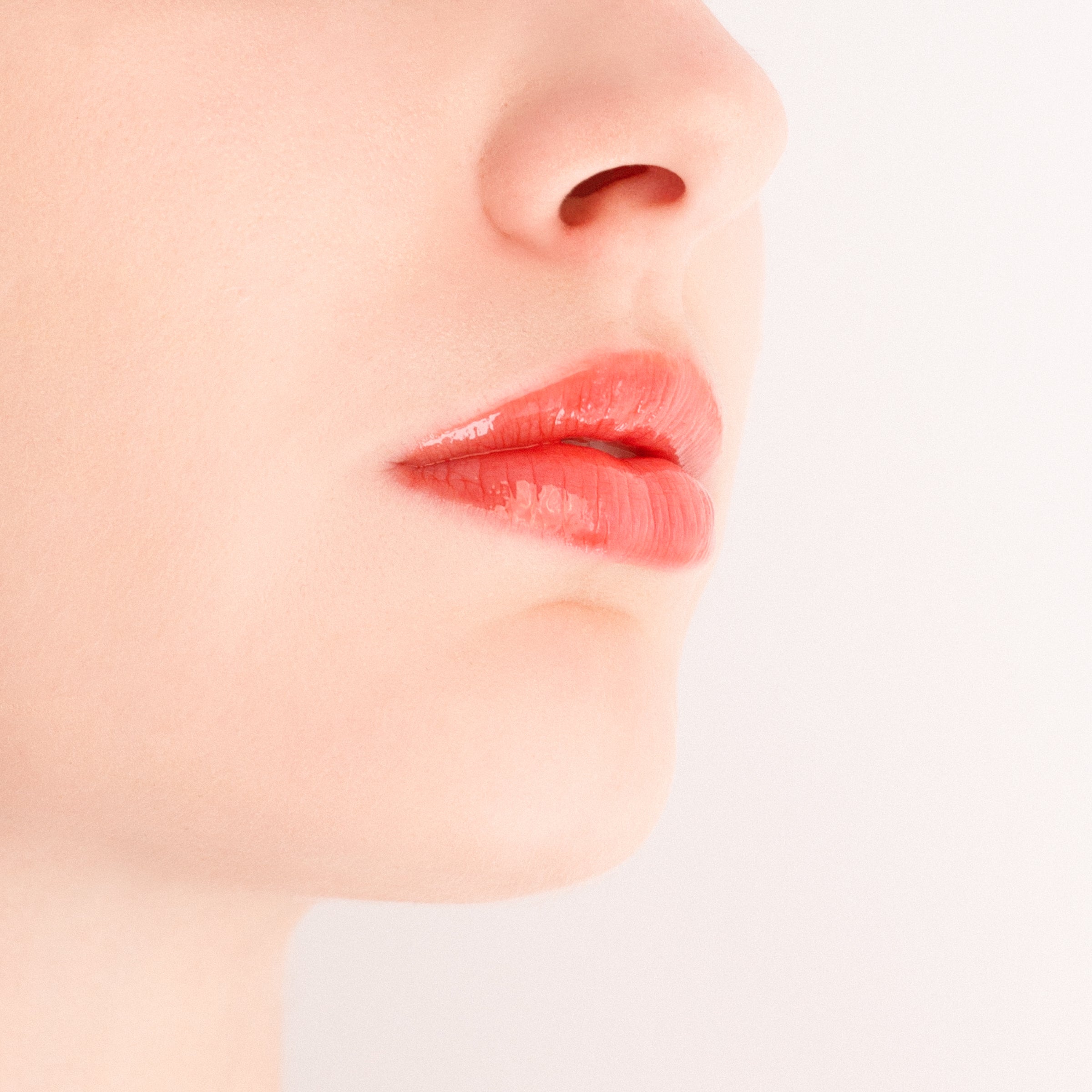 Applying Monika Heiligmann Lips In Love Trio for hydrated, plump, Parisian-inspired lips – available at Amirova
